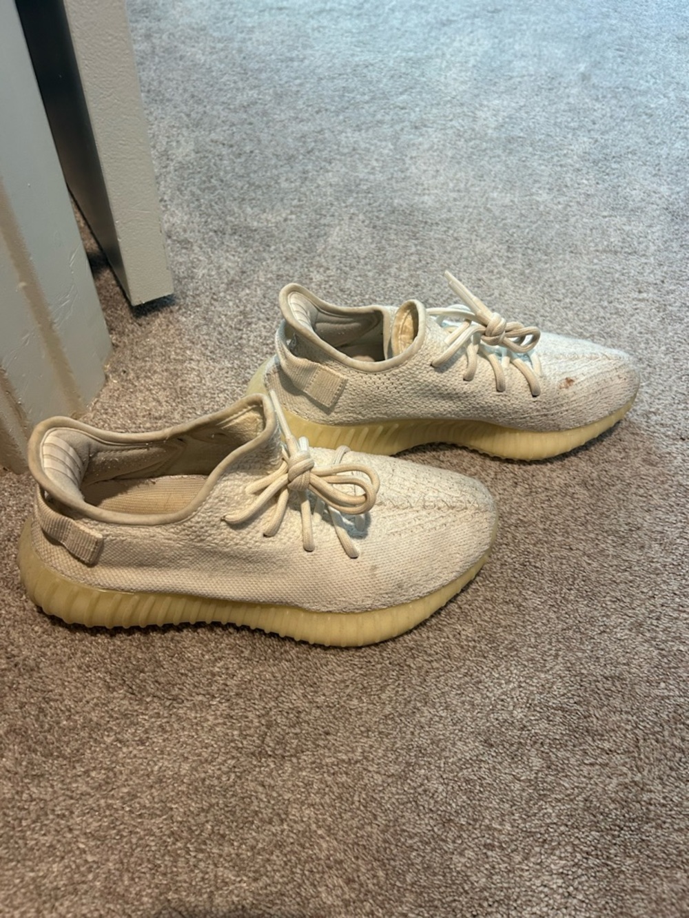 Yeezy Boosts Cream Knit Sneakers with Yellowed Sole